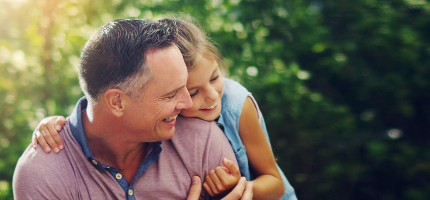 Shot of an affectionate little girl spending quality time with her father outdoors